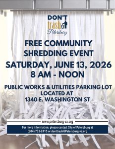 An image of paper being shredded in a shredding machine with text about a community paper shredding event overlain on top.